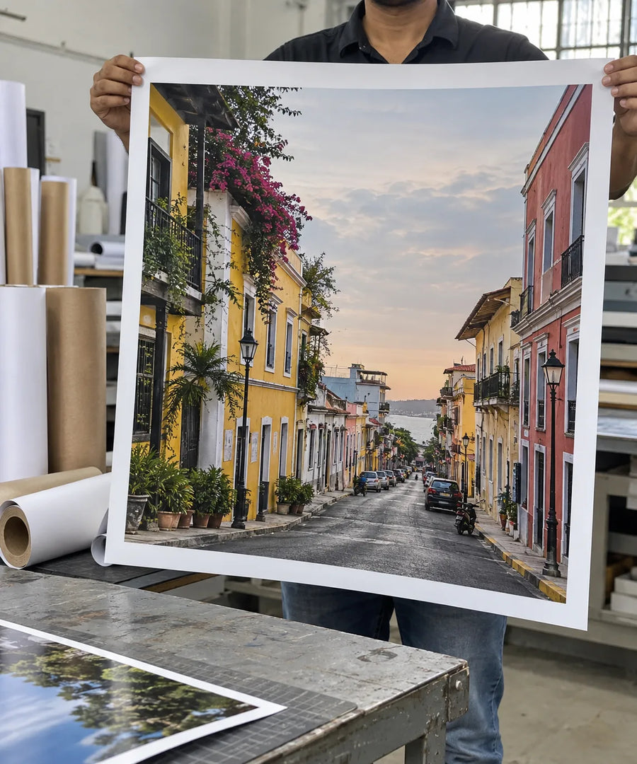 Illustrative view of a large photo print being held in a print studio